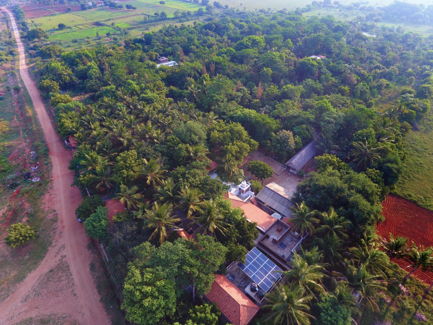Aerial view of Darshan Heritage Living campus surrounded by lush groves